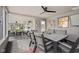 Inviting screened porch with a dining area, comfortable seating, and pleasant outdoor views at 3849 Waycross Dr, Columbus, IN 47203