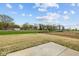 Large backyard with grass and concrete patio, great for outdoor activities at 3913 Highcrest Rd, Indianapolis, IN 46239
