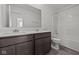 Modern bathroom features a dual sink vanity and tub with shower at 3913 Highcrest Rd, Indianapolis, IN 46239