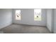 Bright bedroom with two large windows that let in ample natural light, creating a warm atmosphere at 3913 Highcrest Rd, Indianapolis, IN 46239