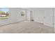 Bright bedroom with plush carpeting, two windows offering natural light, and neutral walls at 3913 Highcrest Rd, Indianapolis, IN 46239