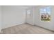Bright bedroom featuring neutral carpet, white walls, and two windows at 3913 Highcrest Rd, Indianapolis, IN 46239