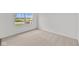 Bedroom featuring neutral carpeting, a bright window, and freshly painted white walls at 3913 Highcrest Rd, Indianapolis, IN 46239
