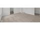 Spacious room featuring neutral carpet and a doorway at 3913 Highcrest Rd, Indianapolis, IN 46239