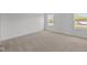Bedroom featuring neutral carpeting, two bright windows, and freshly painted white walls at 3913 Highcrest Rd, Indianapolis, IN 46239