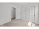 Bright bedroom featuring neutral carpet, white walls, closet and doorway at 3913 Highcrest Rd, Indianapolis, IN 46239