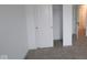 Bedroom with closet, showing carpeting and interior door at 3913 Highcrest Rd, Indianapolis, IN 46239