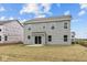 Back of a two-story home with gray siding and a patio at 3913 Highcrest Rd, Indianapolis, IN 46239
