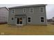 Exterior of a gray two-story home with a walkout patio at 3913 Highcrest Rd, Indianapolis, IN 46239