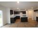 Spacious kitchen features dark cabinets, recessed lighting, and a center island perfect for entertaining at 3913 Highcrest Rd, Indianapolis, IN 46239