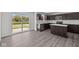 Modern kitchen featuring dark cabinetry, stainless steel appliances, an island, and sleek countertops at 3913 Highcrest Rd, Indianapolis, IN 46239