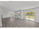 Spacious living room featuring sleek flooring, fireplace, and sliding glass doors at 3913 Highcrest Rd, Indianapolis, IN 46239