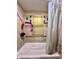 Functional bathroom featuring a bathtub with shower, providing a convenient and clean space at 3932 Caroline Ave, Indianapolis, IN 46205