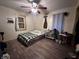 Cozy bedroom with laminate flooring, offering a comfortable and private space for rest and rejuvenation at 3932 Caroline Ave, Indianapolis, IN 46205
