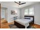 Comfortable bedroom features hardwood floors, neutral paint, and natural light at 4146 Roselawn Ave, Columbus, IN 47203
