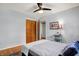 Comfortable bedroom showcasing hardwood flooring, a ceiling fan, and closet at 4146 Roselawn Ave, Columbus, IN 47203
