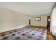 Spacious living room featuring hardwood floors, a patterned rug, and ample natural light at 4146 Roselawn Ave, Columbus, IN 47203