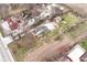 Aerial view showcasing the layout of the home, the surrounding grounds, and other buildings at 435 N Chestnut St, Monrovia, IN 46157