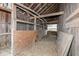 Interior view of barn with wood framing and a plywood and chicken wire wall at 435 N Chestnut St, Monrovia, IN 46157