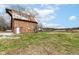 Exterior view of barn with peeling paint and blue sky at 435 N Chestnut St, Monrovia, IN 46157