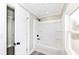 Clean bathroom featuring a white shower-tub combination and a window for natural light at 435 N Chestnut St, Monrovia, IN 46157