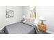 This cozy bedroom features a comfortable bed, natural light from the window, and stylish decor at 435 N Chestnut St, Monrovia, IN 46157