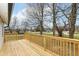 Inviting new deck with wooden railing offers a beautiful view of the surrounding neighborhood at 435 N Chestnut St, Monrovia, IN 46157
