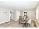 Bright dining room with a wooden table and chairs, providing a cozy space for Gathering meals at 435 N Chestnut St, Monrovia, IN 46157
