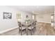 Elegant dining room with a modern table, chairs, hardwood floors, and plenty of natural light at 435 N Chestnut St, Monrovia, IN 46157