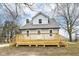 Charming two-story home featuring a new deck, light gray siding and a well-maintained yard at 435 N Chestnut St, Monrovia, IN 46157