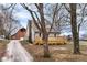 Beautiful gray home with a large wooden deck, barn, and ' play set in the spacious backyard at 435 N Chestnut St, Monrovia, IN 46157