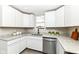 Well-lit modern kitchen with white cabinetry, stainless steel appliances, and granite countertops at 435 N Chestnut St, Monrovia, IN 46157