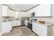 Modern kitchen with white cabinets, stainless steel appliances, and beautiful granite countertops at 435 N Chestnut St, Monrovia, IN 46157