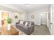 Comfortable living room with a gray sofa, decorative pillows, and a modern geometric rug at 435 N Chestnut St, Monrovia, IN 46157