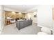 Bright living room with a stone fireplace, recessed lighting, and comfortable gray seating at 435 N Chestnut St, Monrovia, IN 46157