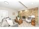 Inviting living room featuring a stone fireplace, recessed lighting, and comfortable seating arrangement at 435 N Chestnut St, Monrovia, IN 46157