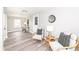 Bright living room featuring stylish chairs, wood-look floors, and natural light at 435 N Chestnut St, Monrovia, IN 46157