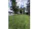 Spacious backyard featuring mature trees and an open lawn at 4904 Betholm Dr, Indianapolis, IN 46239