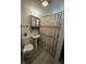 Bathroom featuring a small pedestal sink and shower at 4904 Betholm Dr, Indianapolis, IN 46239