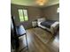 Cozy bedroom featuring a window, closet, and comfortable queen-sized bed at 4904 Betholm Dr, Indianapolis, IN 46239