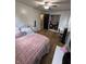 Bright bedroom with vanity, a closet with a view to the bedroom at 4904 Betholm Dr, Indianapolis, IN 46239