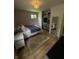 This cozy bedroom features a closet and a queen-sized bed with an antique rug at 4904 Betholm Dr, Indianapolis, IN 46239