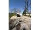 Long driveway leading to a detached garage, offering plenty of parking space at 4904 Betholm Dr, Indianapolis, IN 46239