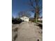 Long driveway leading to a detached garage, offering plenty of parking space at 4904 Betholm Dr, Indianapolis, IN 46239