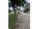 Exterior of house with a cracked driveway and swing at 4904 Betholm Dr, Indianapolis, IN 46239