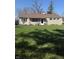 Charming single-story home featuring a well-manicured lawn and stone facade at 4904 Betholm Dr, Indianapolis, IN 46239