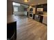Modern kitchen featuring stainless steel appliances, hardwood floors, and great lighting at 4904 Betholm Dr, Indianapolis, IN 46239