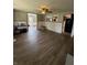Open-concept living room with wood flooring and plenty of natural light at 4904 Betholm Dr, Indianapolis, IN 46239