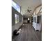 Bright living space featuring hardwood floors, many windows and a cathedral ceiling at 4904 Betholm Dr, Indianapolis, IN 46239