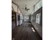 Living area featuring lots of natural light, hardwood floors, and tall ceilings at 4904 Betholm Dr, Indianapolis, IN 46239